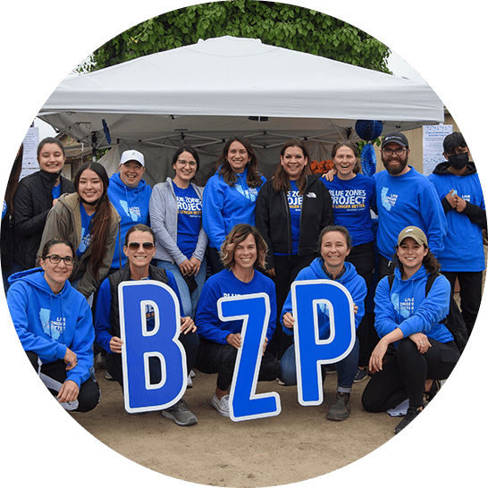 Blue Zones Project staff with BZP signs.