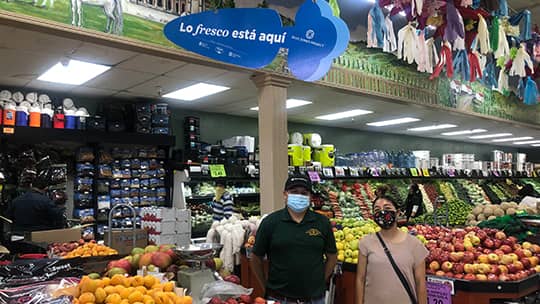 Blue Zones Project signs at a grocery store.